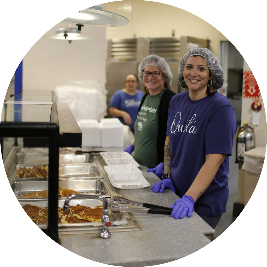 Volunteers serving food Pancake & Sausage Day 2025